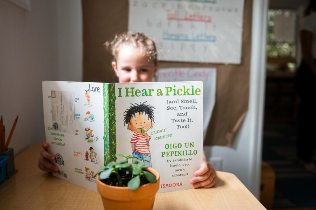 student reading book about pickles