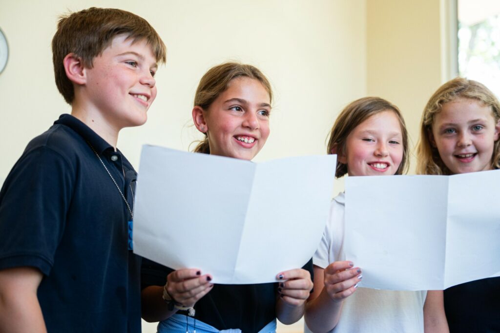 students with music sheets