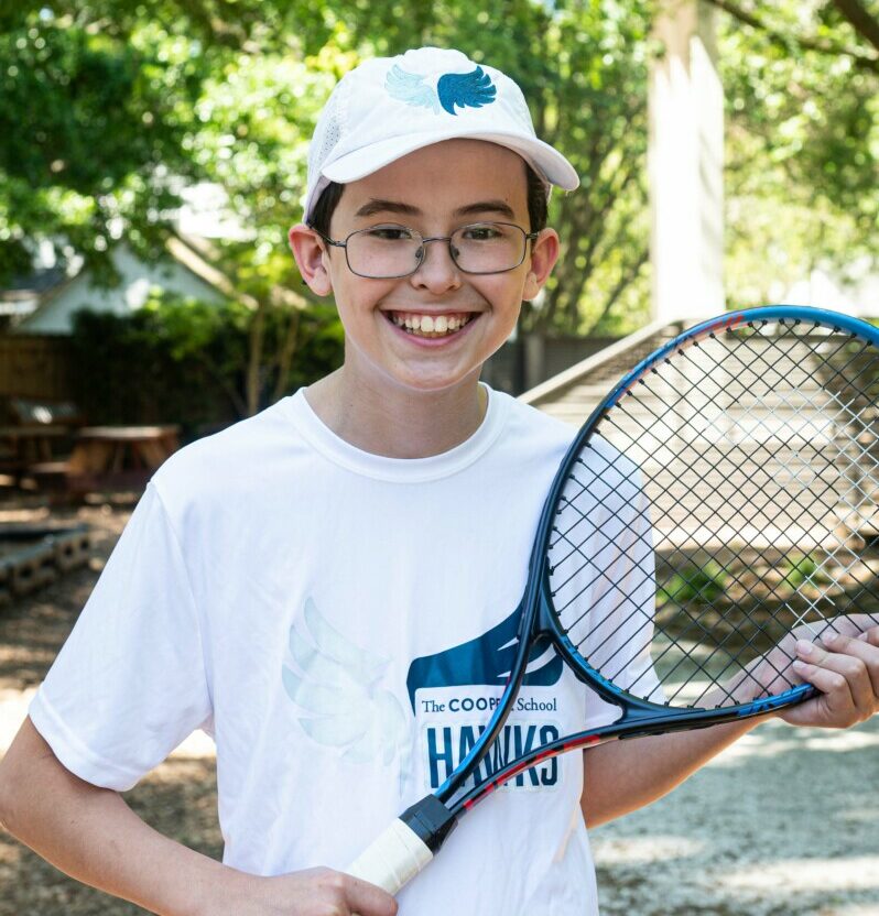 kid with tennis racket