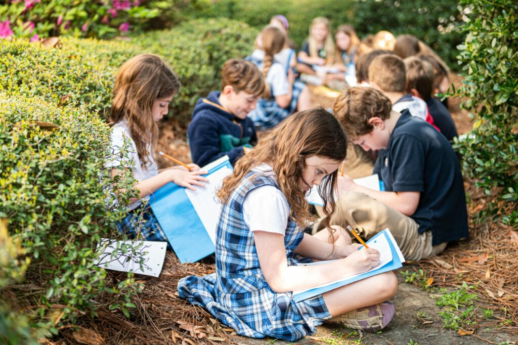 kids in garden studying plants